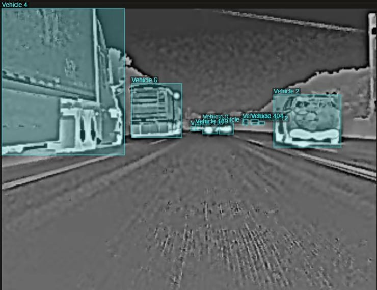 Thermal highway scene with near and far vehicles labeled