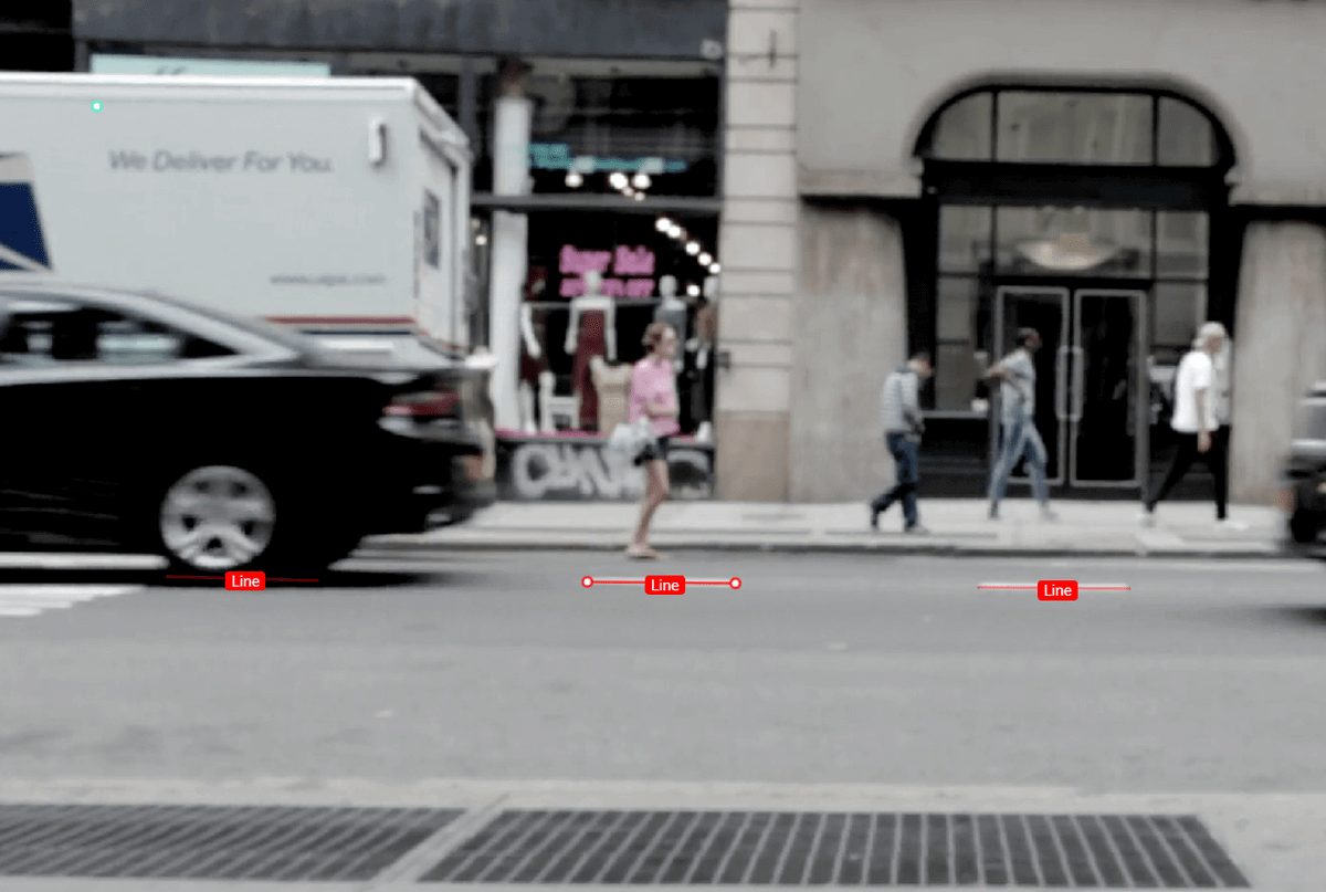 This is an example of image annotation using a polyline. It is an image of a street scene. The street’s lane line is the object of interest, and it is annotated with line segments that are labeled.