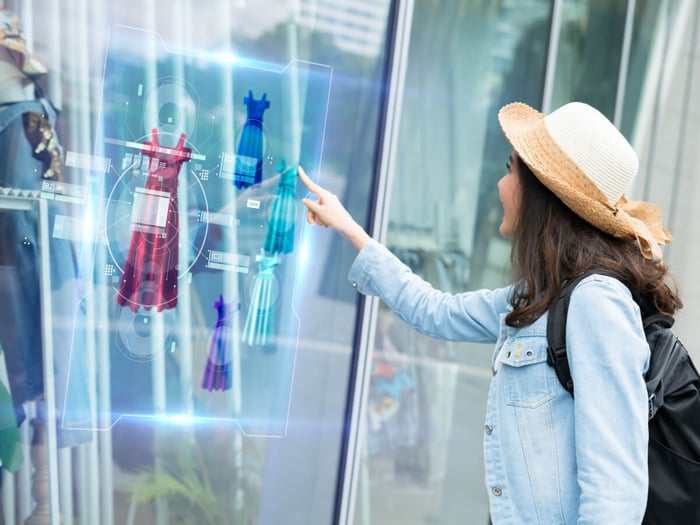 Woman-shopper-choosing-clothing-using-virtual-augmented-reality