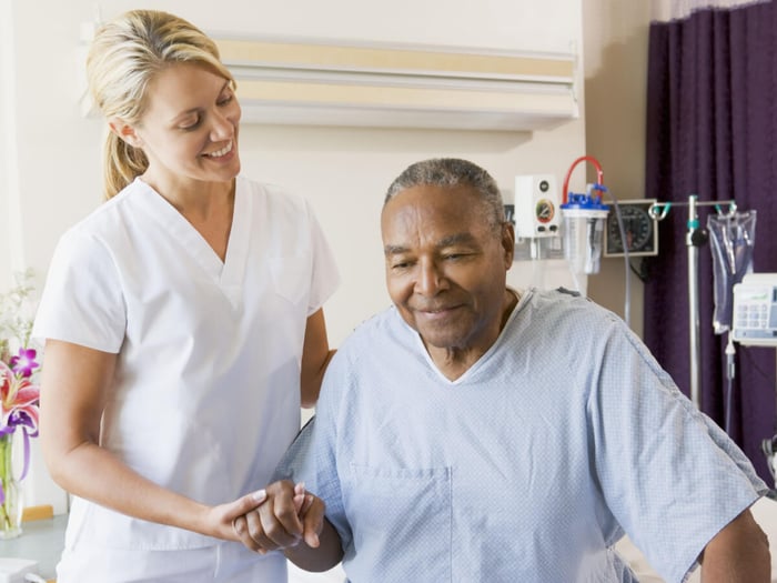 nurse-helping-patient-get-out-of-bed-safely