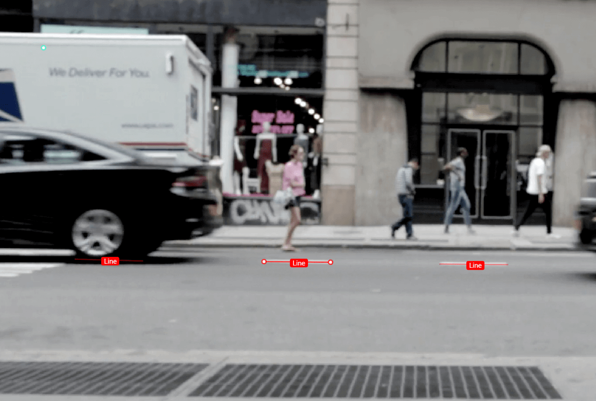 image annotation meaning This is an example of image annotation using a polyline. It is an image of a street scene. The street’s lane line is the object of interest, and it is annotated with line segments that are labeled.