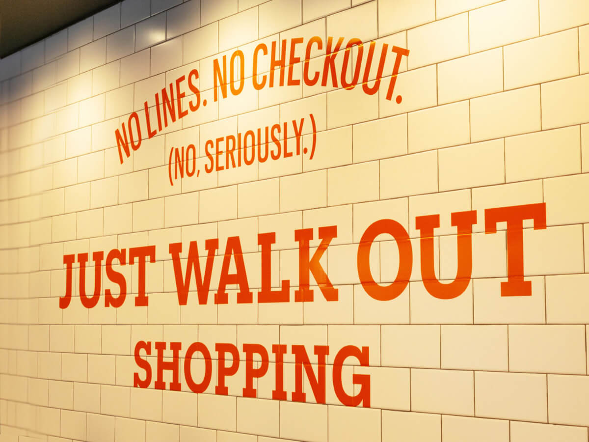 An advertisement inside a retail location. It says, “No lines. No checkout. No seriously. Just walk out.